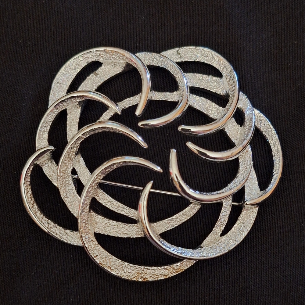 Vintage Sarah Coventry brooch, often recognized as the "Tailored Swirl" design f